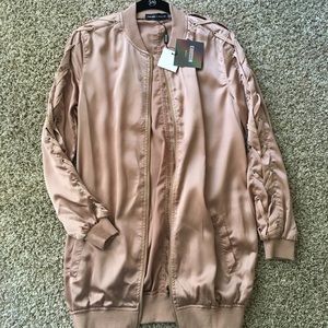 Carli Bybel rose gold bomber jacket